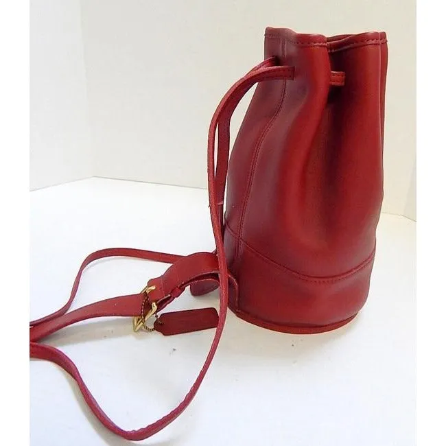 vintage, Coach, 'Bixby', large, drawstring top, bucket shaped, satchel style, sling style shoulder bag or backpack in buttery soft red leather with brass accents